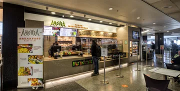 Customer at the counter of Amoura in Terminal 3