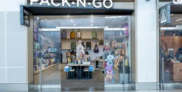 PACK N GO exterior with bags on display at Harvey Milk Terminal 1