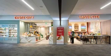 Taste City exterior, seating, and item display in Harvey Milk Terminal 1, SFO