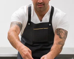 Chef preparing entrees for Proper Foods